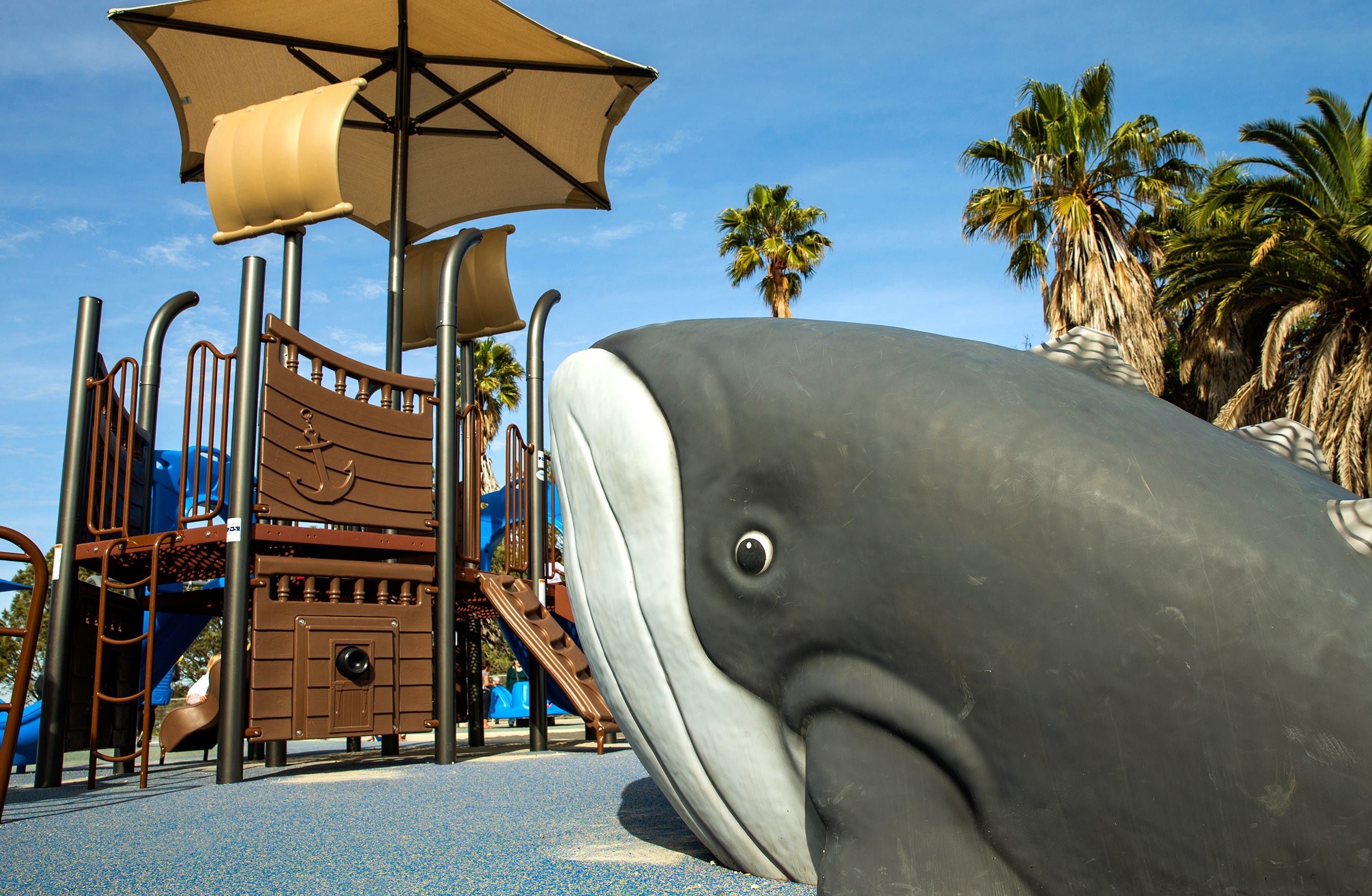 Whale-themed Fun Forms sculpture beside a ship-themed playground
