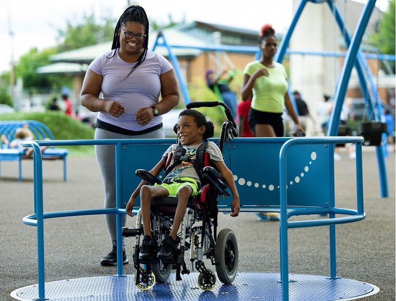 Children playing together on an inclusive playground