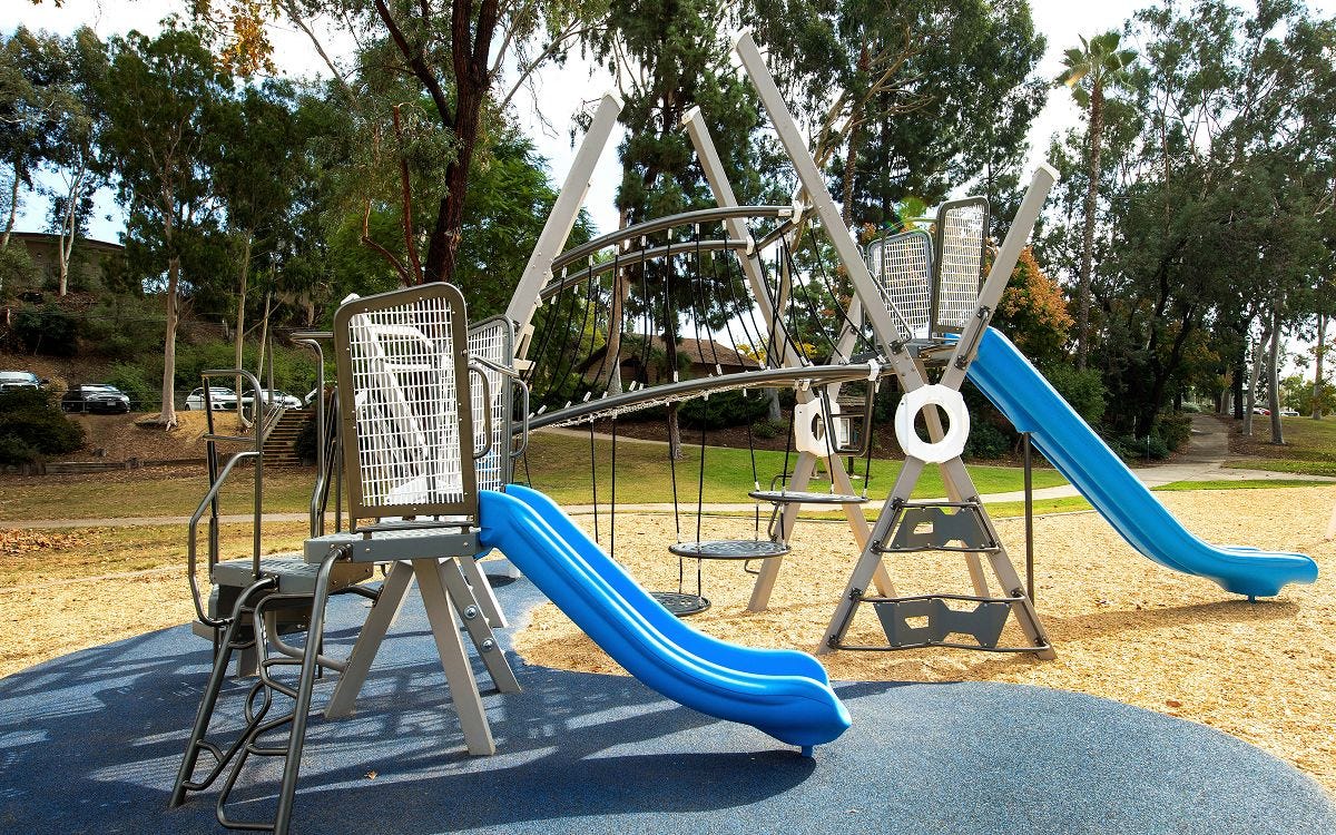 Modern City X Series playground with multi-tiered climbing areas