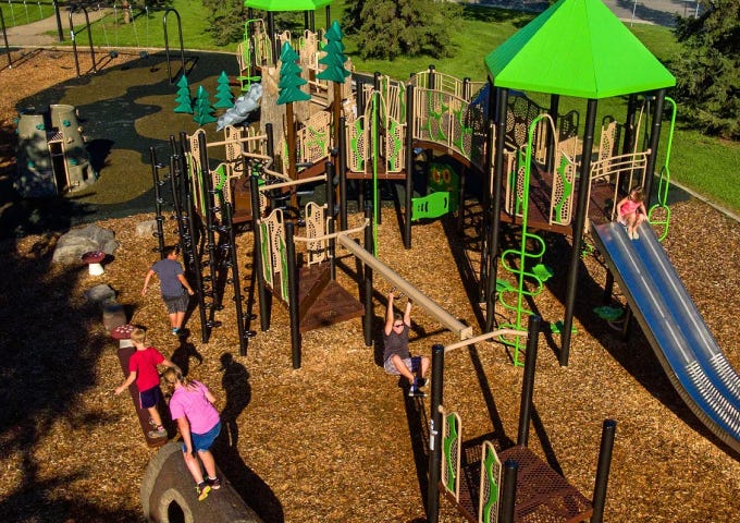 PowerScape playground system with decks, climbers and play activities