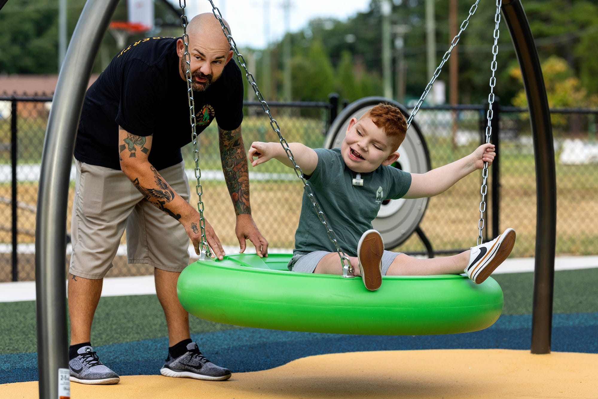 Children playing together on inclusive playground equipment at Jamestown Park