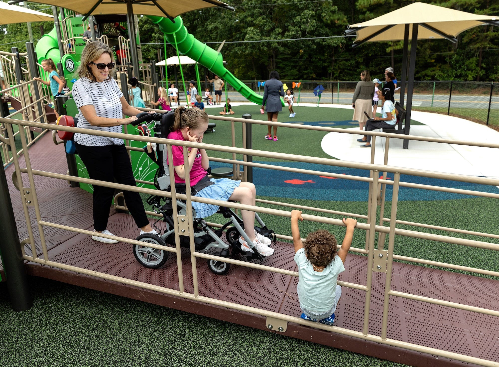 Child using inclusive swing at Jamestown Park